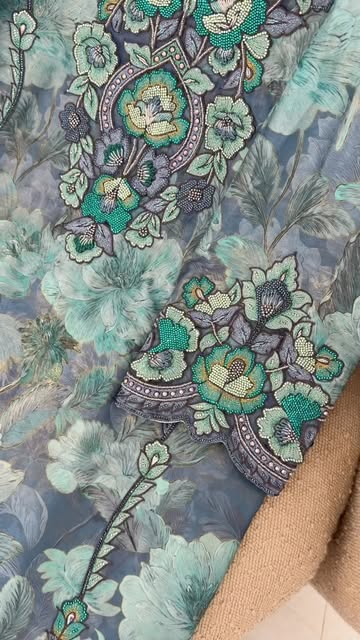 Detailed teal floral embroidery and crystal work